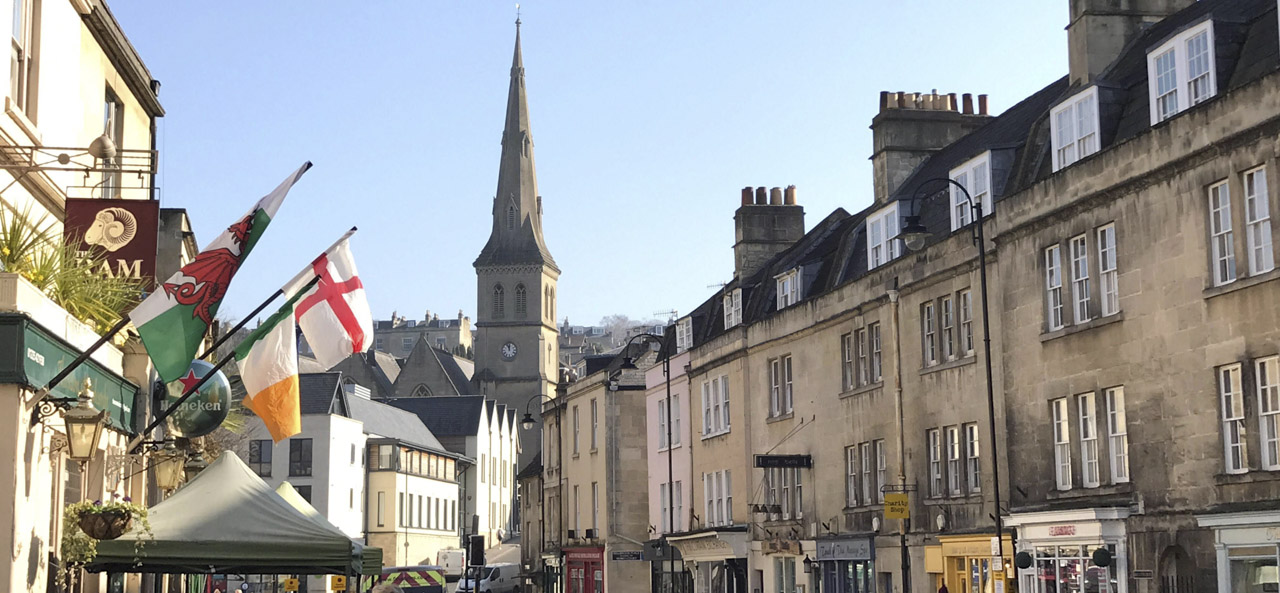 Photo of Widcombe in Bath with shops and church spire